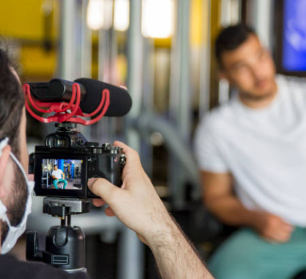 Videographer With Surgical Mask Behind The Camera